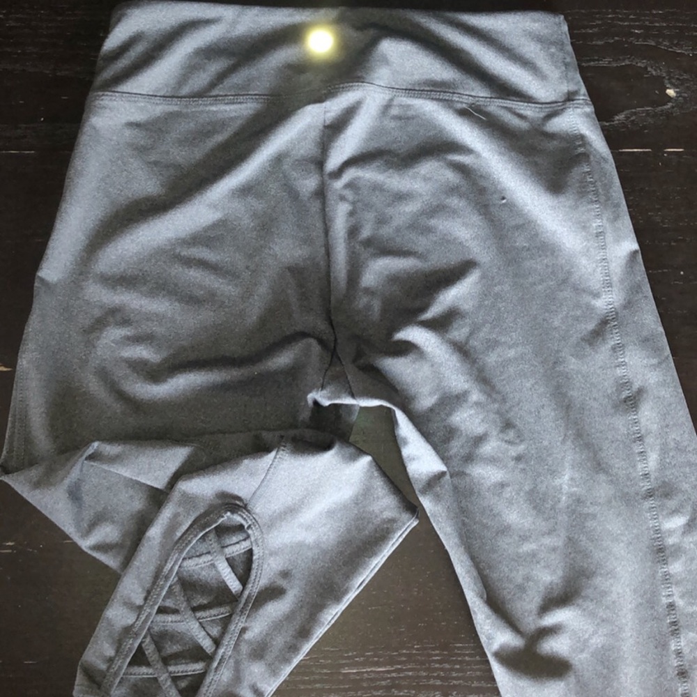 gray athletic leggings with crossed ankles